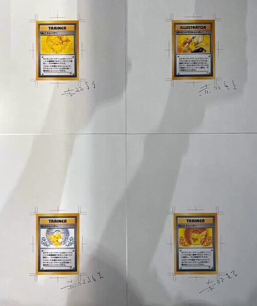 Foglio con carte pikachu e firma di akabane